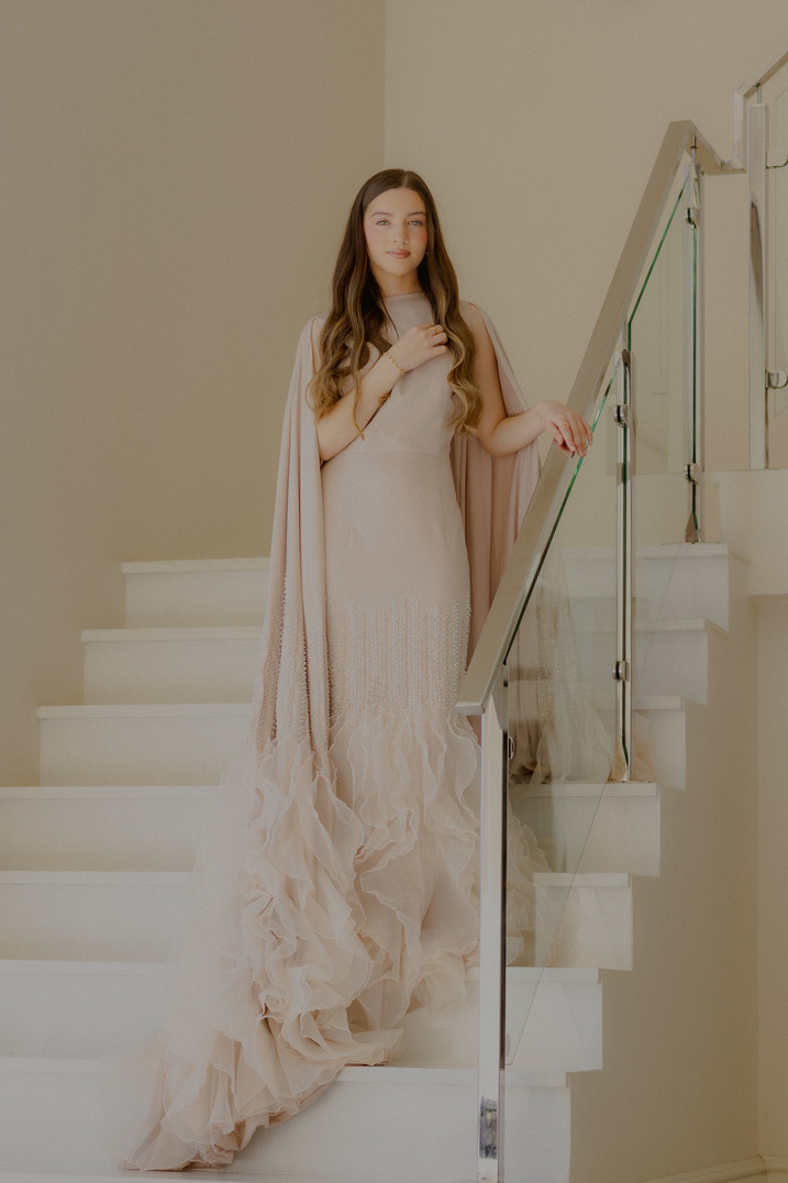 Champagne Affair gown on a softly lit staircase